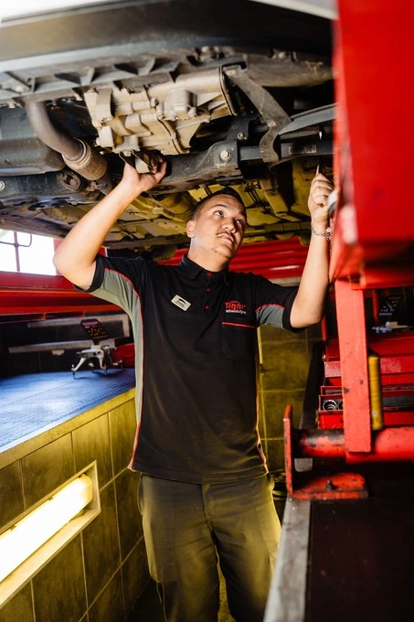 A Tiger Wheel & Tyre mechanic performing a free vehicle safety check