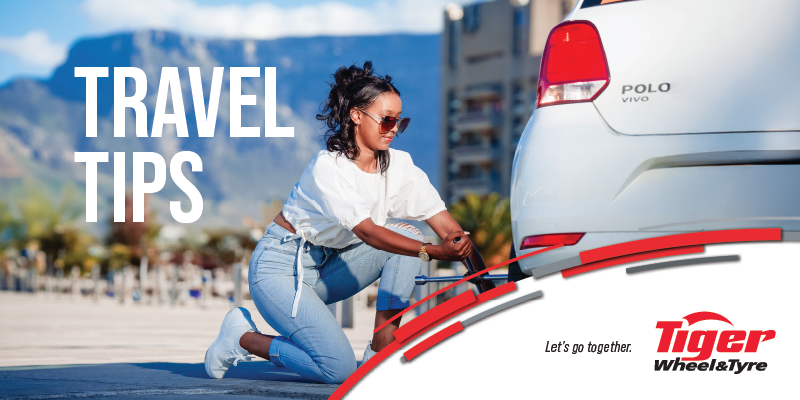 a woman changing a tyre