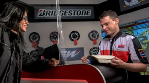 Promotions Sales person talking to a customer